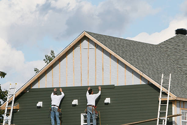 Professional Storm Damage Siding Repair technician working in Batavia, IL